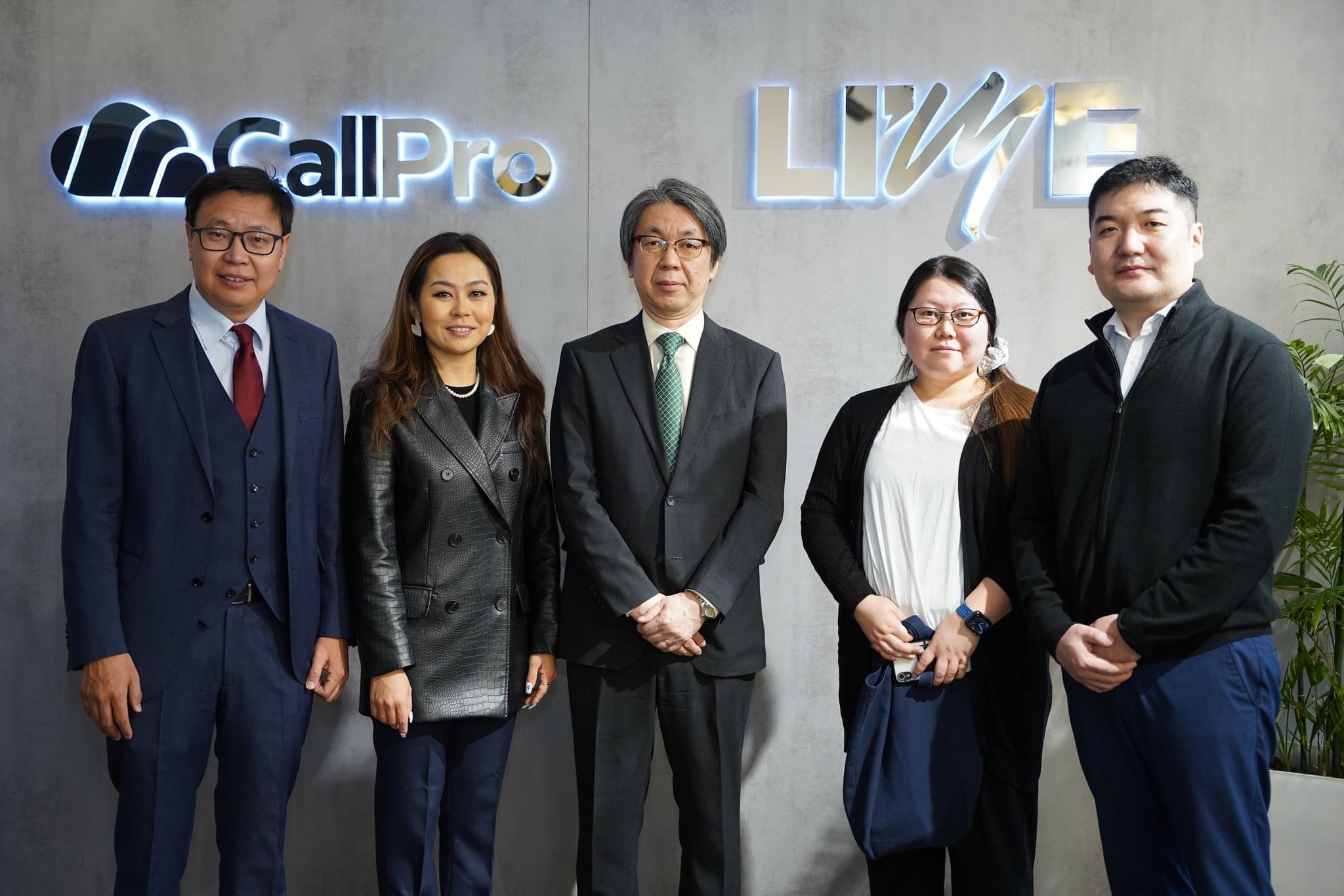 Group photo in front of the CallPro and LIME office signs