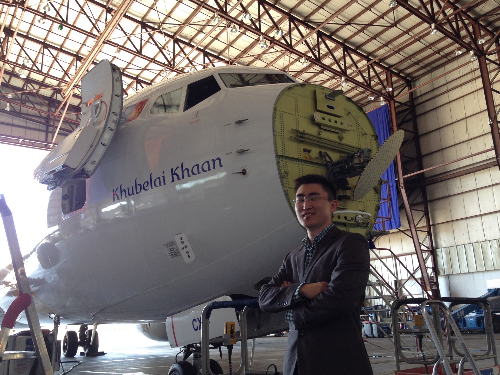 A person beside an aircraft in a MIAT hangar